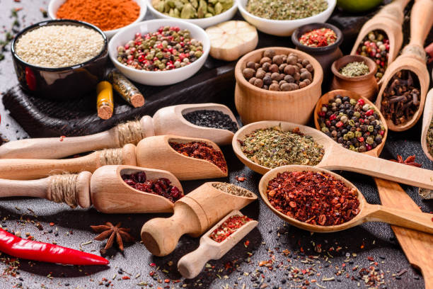 istock Pepper, salt, paprika, basil and other on a dark background 1216779111