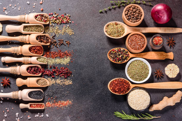istock Pepper, salt, paprika, basil and other on a dark background 1216779155