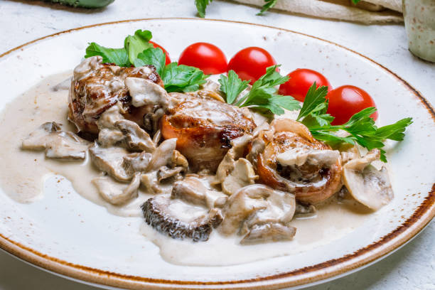 istock Pork medallions with bacon 1216779297