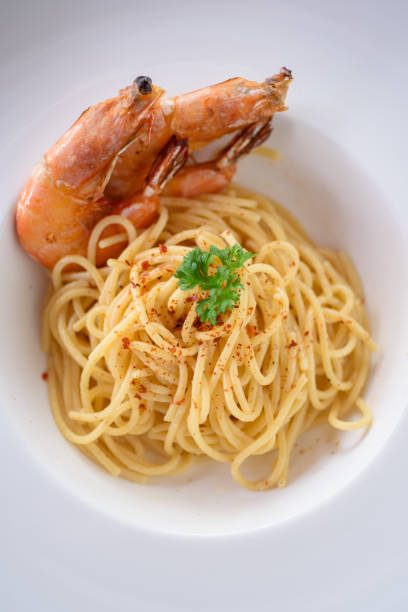 istock Spaghetti Aglio-Olio with pan fried prawn 1216782632