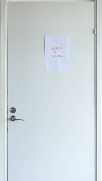 istock Conference room door with meeting in progress notice 1216782665