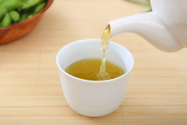 istock The green tea which I poured with a teapot 1216782848