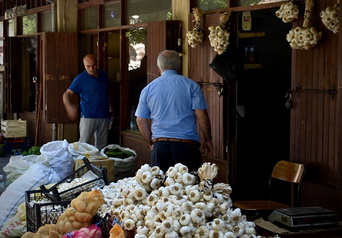 Gaziantep / Turkey - 31 July 2019 : Bundle of garlics in a fresh food market