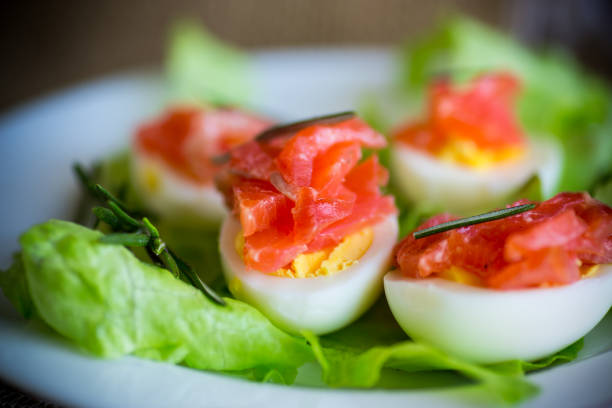 istock boiled eggs with salted red fish and salad leaves 1216785591