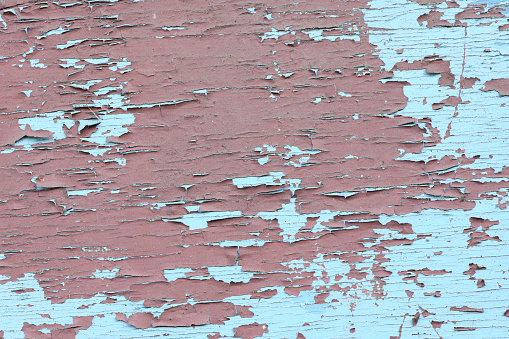 Old painted iron red blue texture background. Grunge rusted metal background. Dirty red metal crack. Cracked paint, rust surface. High resolution photo. Full depth of field.