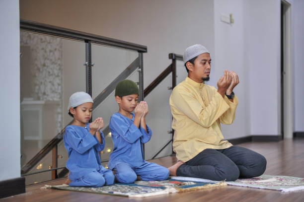 istock Muslim family worship during ramadhan 1216787177