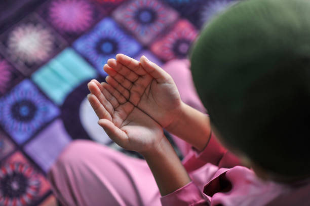 istock Muslim family worship during ramadhan 1216787195