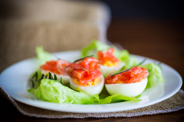 istock boiled eggs with salted red fish and salad leaves 1216787785