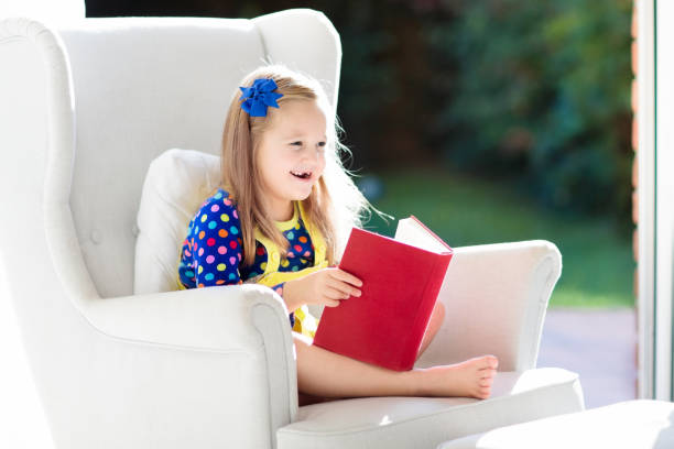 istock Child reading book. Kids read books. 1216787865