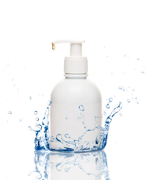 istock bottle of liquid soap and water splashes 1216789710