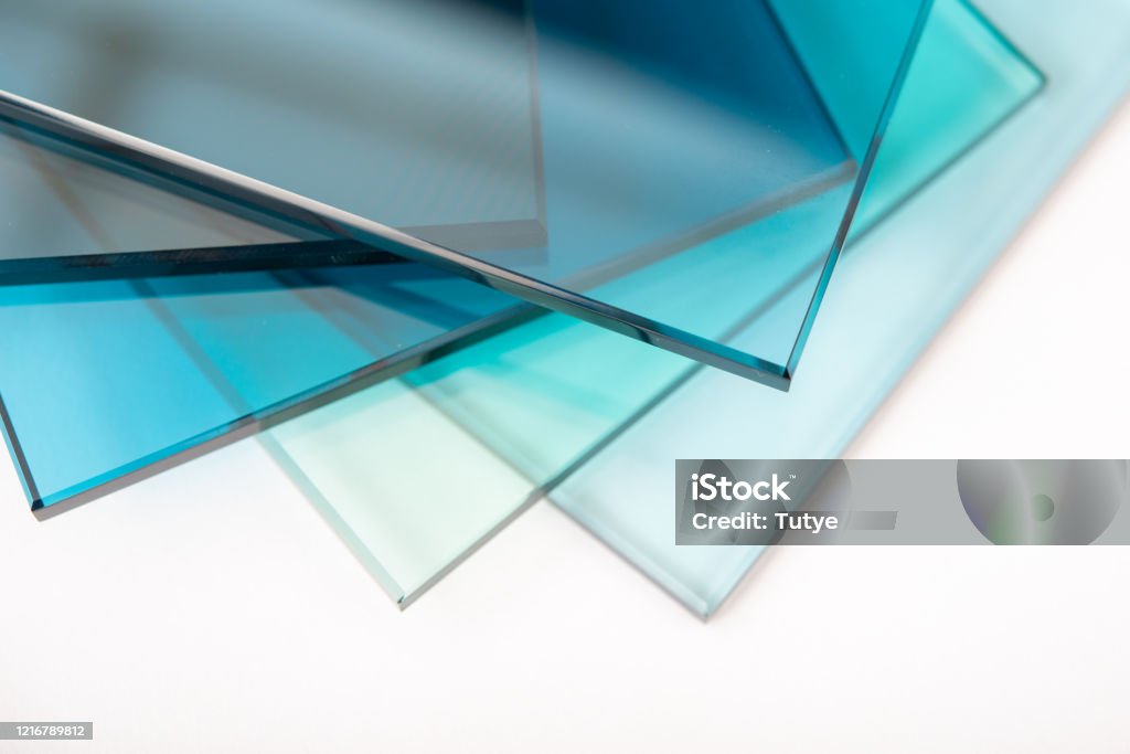 Sheets of Factory manufacturing tempered clear float glass panels cut to size Glass - Material Stock Photo