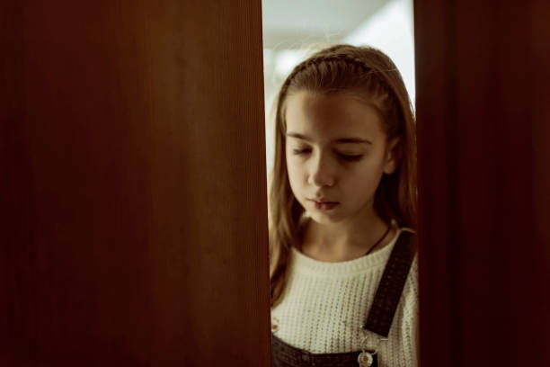 istock A scared girl should not leave the room - COVID-19 1216790843