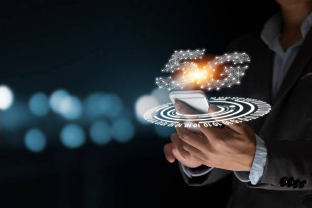 istock Businessman holding mobile phone with 5G infographic. 5 Generation wireless technology of mobile signal which big change for internet of thing. 1216791038