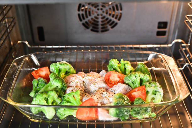 istock turkey legs with vegetables. before baking in the oven. Fried chicken legs with white rice and vegetables 1216793269