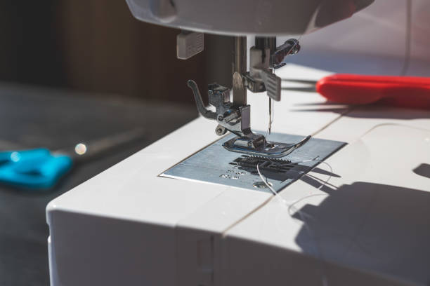 istock Sewing at home: Close up picture of sewing needle 1216793572