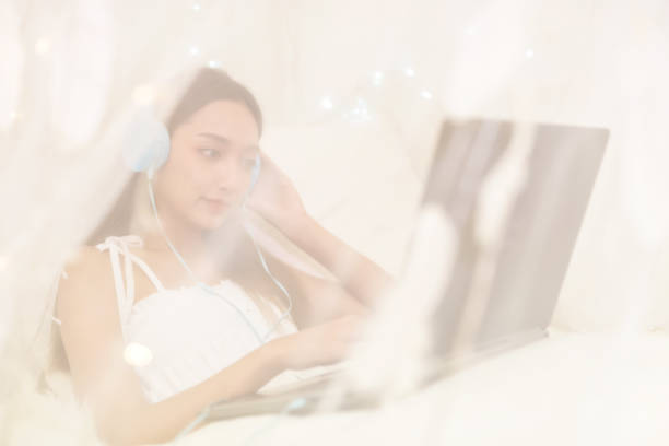 istock Woman work from home in bedroom 1216798293
