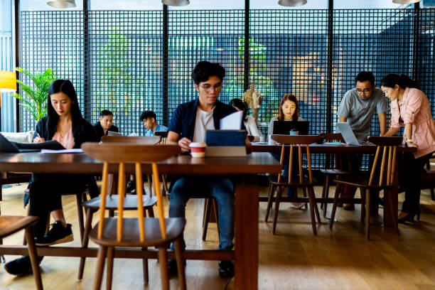 istock Asians Millennials working in busy coworking space 1216798471