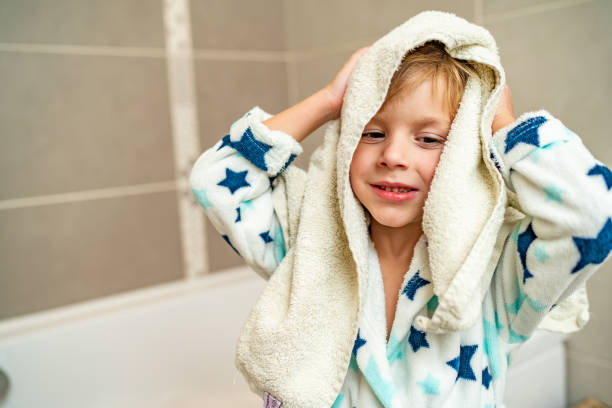 istock Closeup boy drying up his hair 1216800167