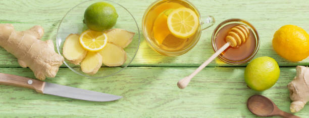 istock Ginger tea and ingredients on a  grunge wooden background 1216801990