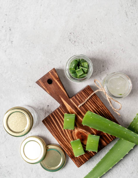 istock Top view of aloe vera slices on a cutting board with copy space 1216802978