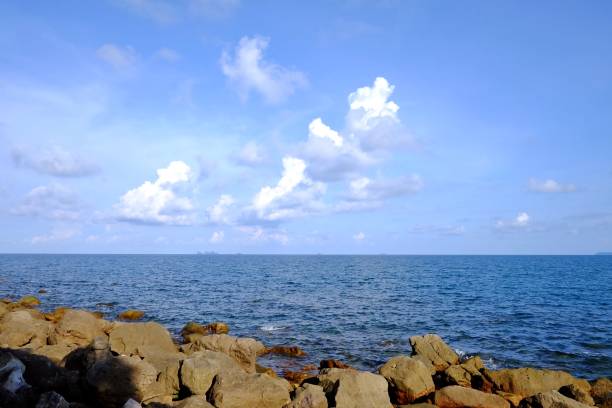 istock Blue sksy white fluffy clouds with blue sea 1216804039