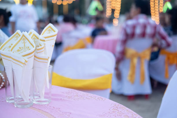 White yellow tissue paper in glass on table, close up