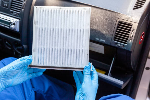 Replacing cabin pollen air filter for a car as prevention against coronavirus disease Replacing cabin pollen air filter for a car passenger cabin photos stock pictures, royalty-free photos & images