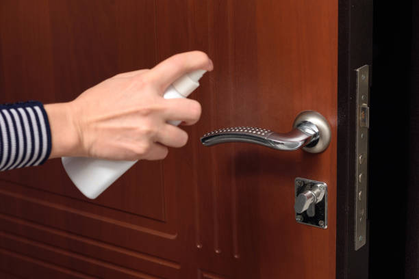 istock Hand protects the handle on the entrance door 1216806436