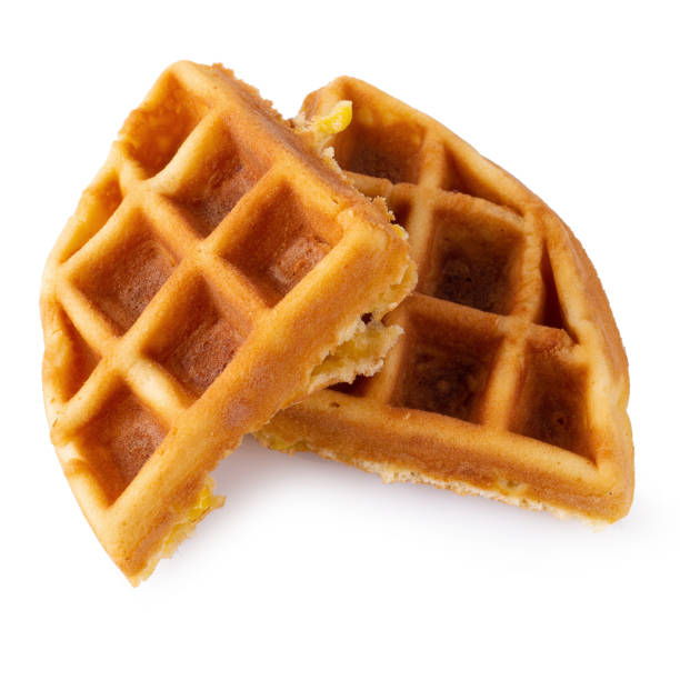 istock Freshly baked waffles isolated over white background. 1216806718
