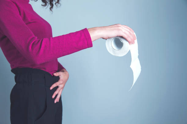 istock woman hand toilet paper 1216808100