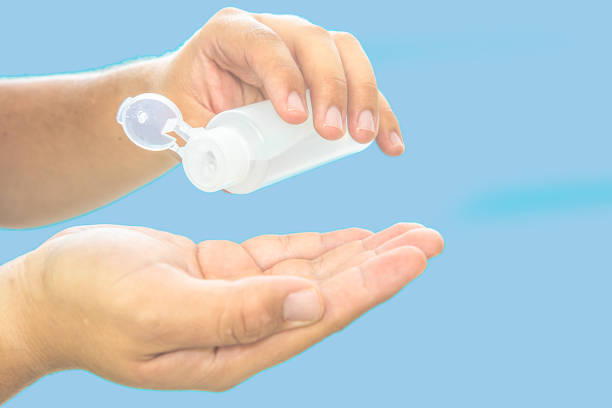 istock Cleaning hands with gel alcohol 1216808260