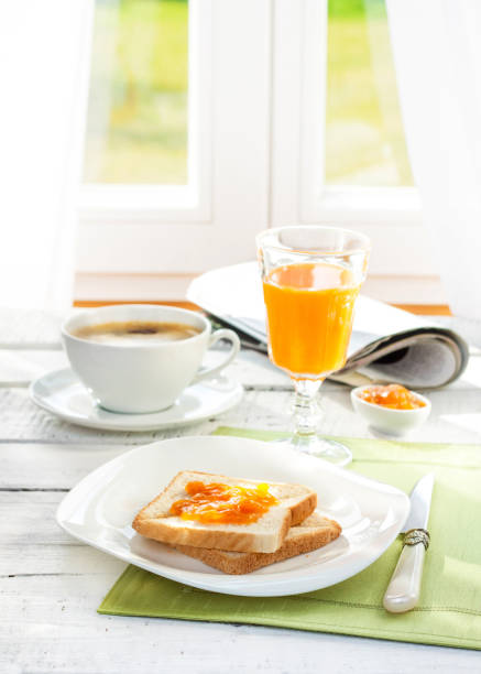 istock Continental breakfast - coffee, orange juice and toast 1216808955