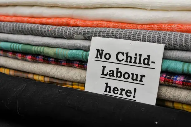 Photo of Sign at a cloth shop advising customers the no child labour is used in the production of their goods.