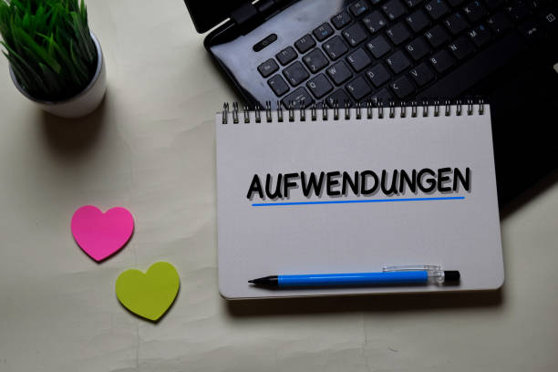istock Aufwendungen write on a book isolated on office desk. German Language it means Operating Costs 1216811787