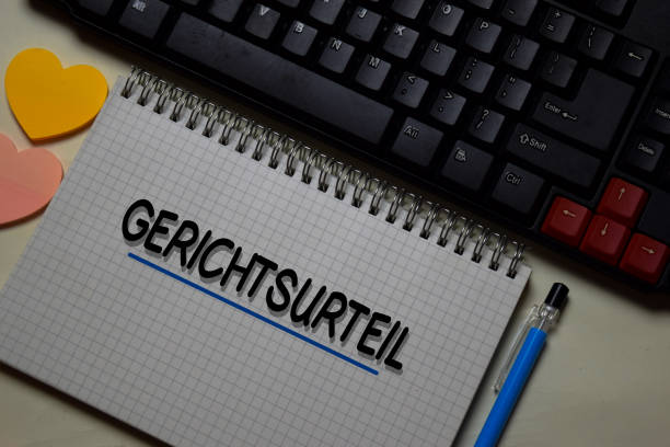 istock Gerichtsurteil write on a book isolated on office desk. German Language it means Judgement 1216811822