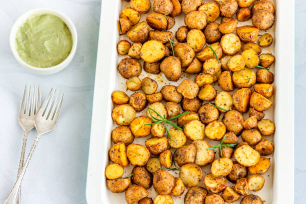 istock Roasted Potato with Rosemary on White Background 1216811899