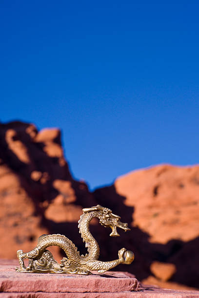istock Brass Chinese Zodiac Dragon and Sandstone Rocks 121681312