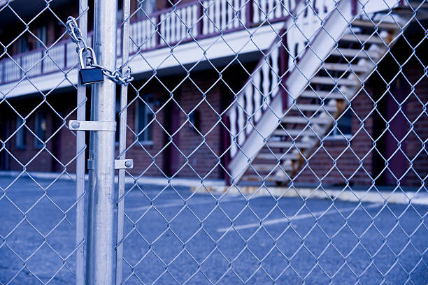 istock Abandoned Hotel and Chain Link Fence 121681391