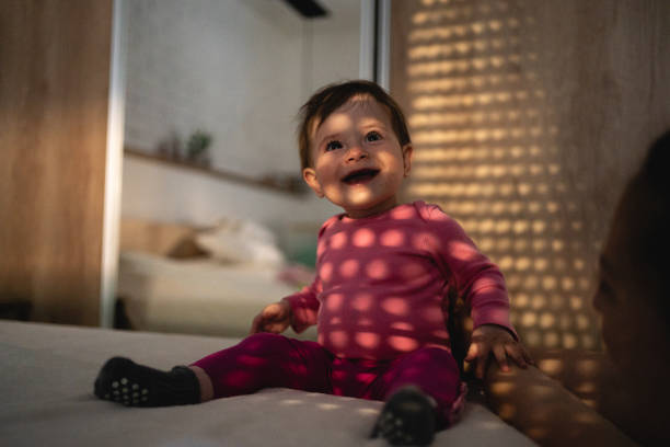 istock Curious baby girl smiling while looking around and exploring 1216813990