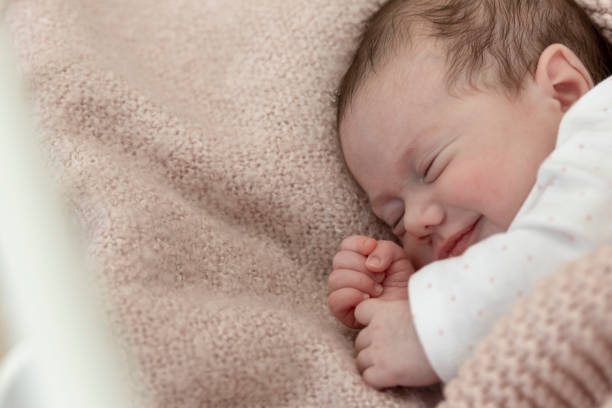istock Baby girl sleeping in a crib 1216816170