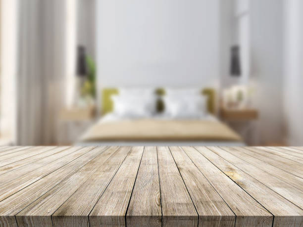 istock Concept wooden textured desk with blur interior. 1216818244