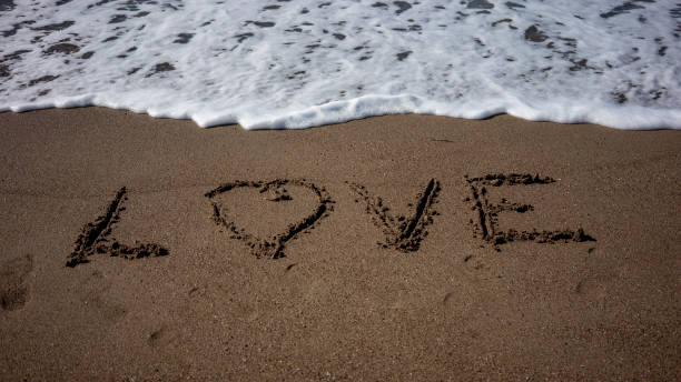istock Love Sign On The Beach 1216819277