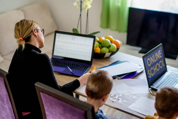 istock Mother working from home with young children in quarantine isolation 1216820668