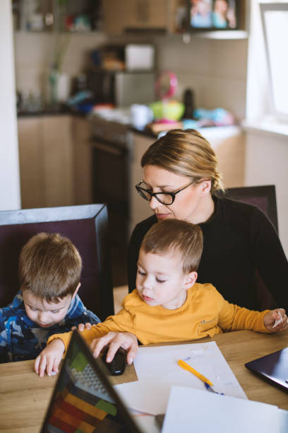 istock Mother working from home with young children in quarantine isolation 1216822321