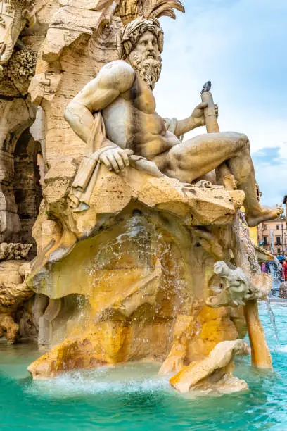 Rome, Italy. River god Ganges representing Asia, at the Fountain of Four Rivers (Fontana dei Quattro Fiumi) in Piazza Navona. Sculptures of river gods depict major rivers of papal authority continents