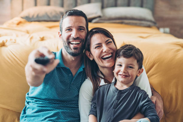 istock Family watching television together 1216824019
