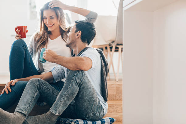 istock Lovely couple drinking coffee and tea together 1216824027