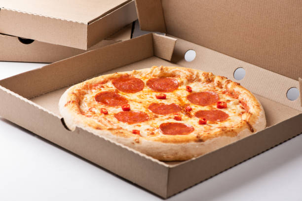 istock Pizza Pepperoni Salami inside open box on tall stack of delivery boxes 1216827519