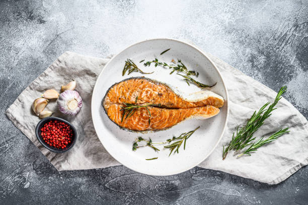 istock Grilled salmon steak. Atlantic fish. Gray background. Top view 1216828009