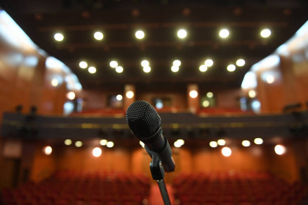 istock Microphone in front of an empty theatre hall 1216828821